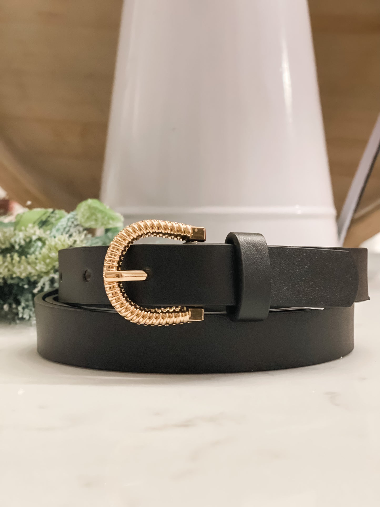 Classic black belt with gold detailing as a buckle